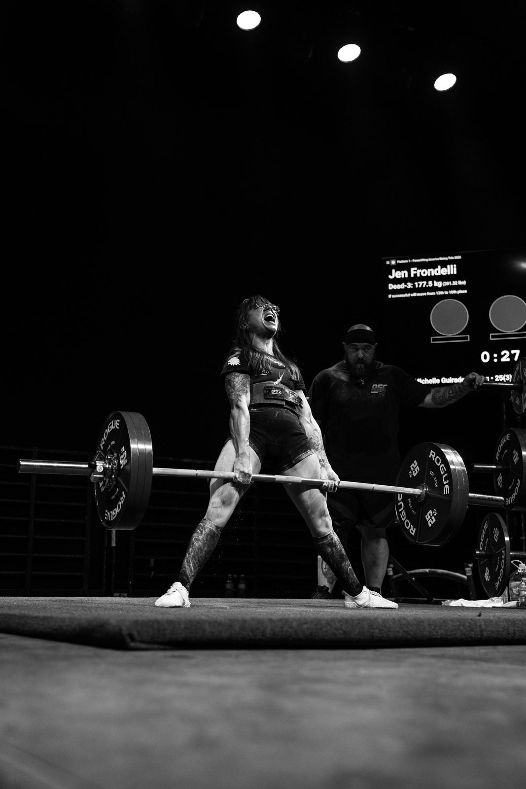 Deadlift under the lights, black and white